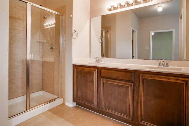 bathroom featuring vanity, an enclosed shower, and tile patterned flooring