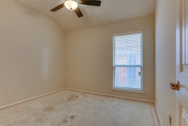 spare room featuring lofted ceiling and ceiling fan