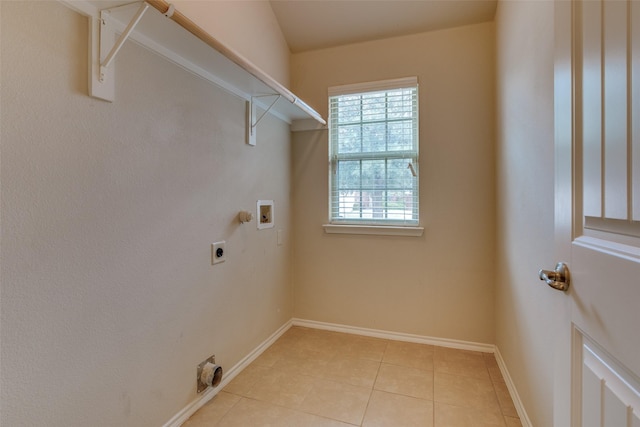 laundry area featuring light tile patterned flooring, washer hookup, and hookup for an electric dryer