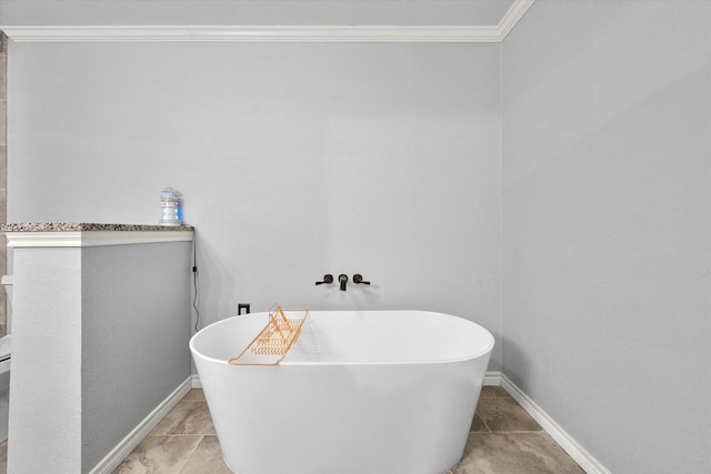 bathroom featuring a bath and crown molding