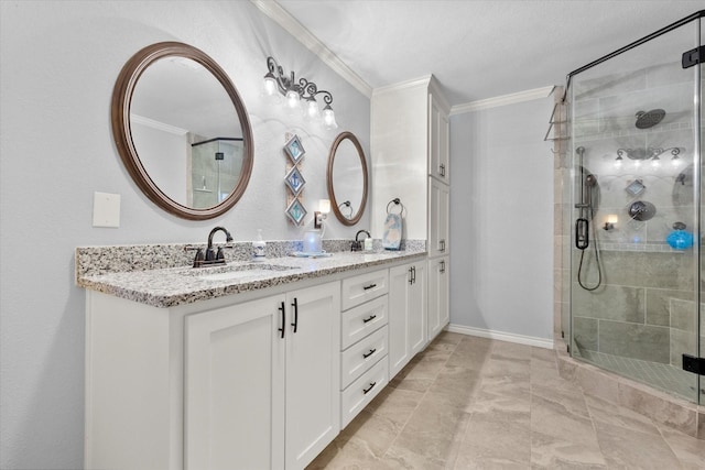 bathroom featuring vanity, crown molding, and a shower with shower door