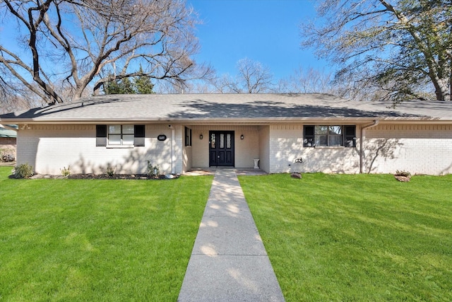 ranch-style home with a front lawn