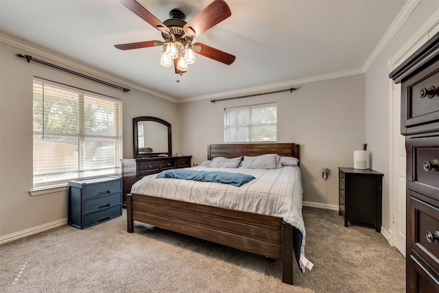 bedroom featuring ornamental molding, light carpet, and ceiling fan