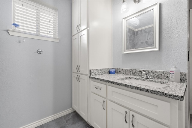 bathroom with vanity and tile patterned flooring