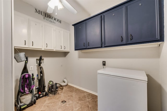 laundry room featuring light tile patterned floors, cabinets, and ceiling fan