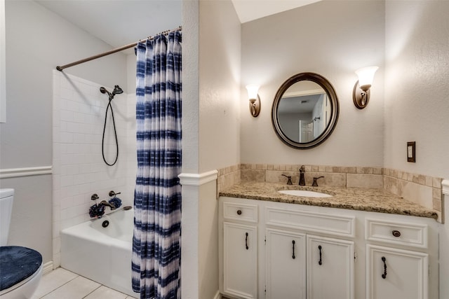 full bathroom featuring vanity, shower / bath combo, tile patterned floors, and toilet