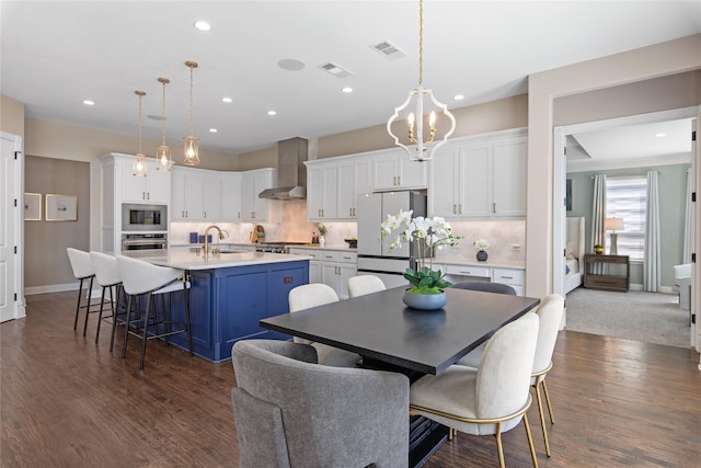 dining room featuring visible vents, recessed lighting, a notable chandelier, and dark wood-style floors