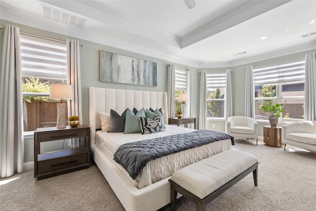 bedroom with crown molding, carpet flooring, multiple windows, and visible vents