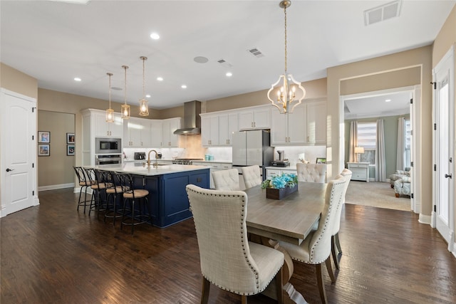 dining room featuring dark hardwood / wood-style flooring and sink