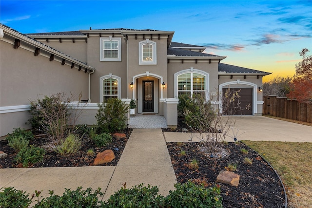 mediterranean / spanish-style house featuring a garage