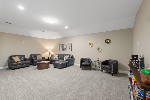 carpeted living room with visible vents, recessed lighting, and baseboards