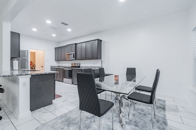 dining room featuring sink