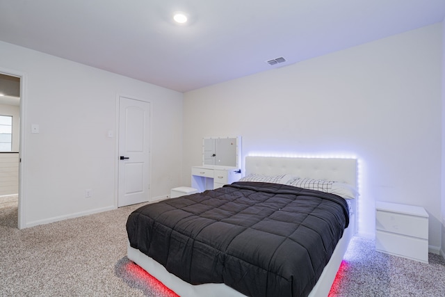 bedroom featuring light colored carpet