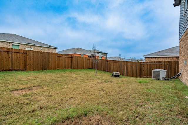 view of yard featuring central AC