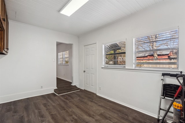 unfurnished room featuring dark hardwood / wood-style flooring