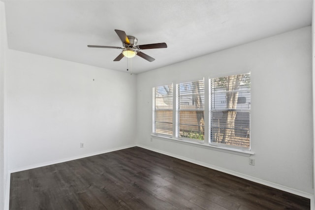 unfurnished room featuring dark hardwood / wood-style flooring and ceiling fan