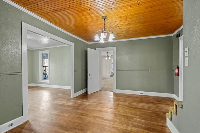 unfurnished dining area with crown molding, hardwood / wood-style floors, wooden ceiling, and ceiling fan with notable chandelier