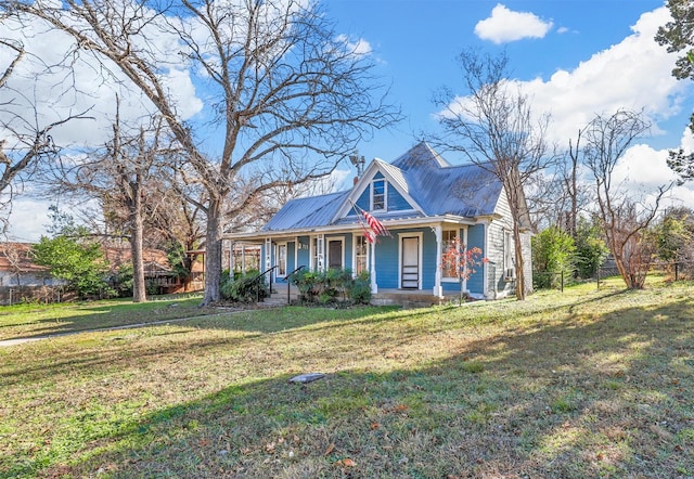 view of front of home with a porch and a front lawn