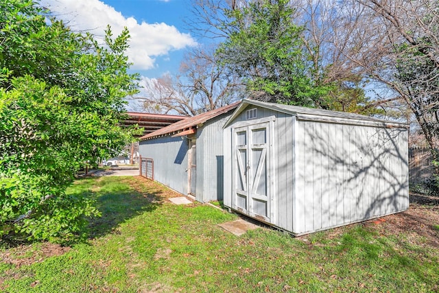 view of outdoor structure with a lawn