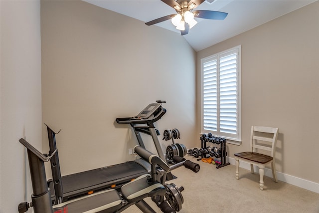 workout area with ceiling fan, lofted ceiling, carpet flooring, and a wealth of natural light