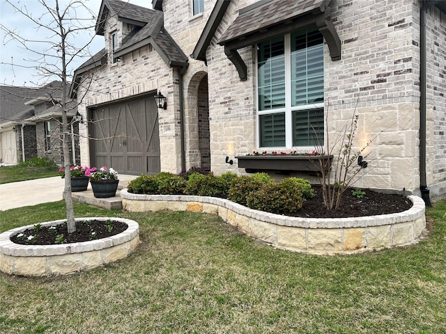 view of exterior entry with a lawn