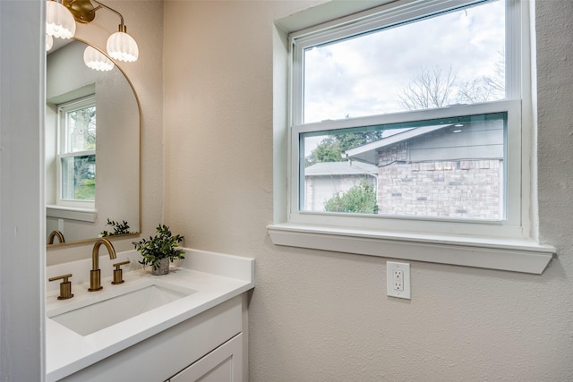 bathroom with vanity and plenty of natural light