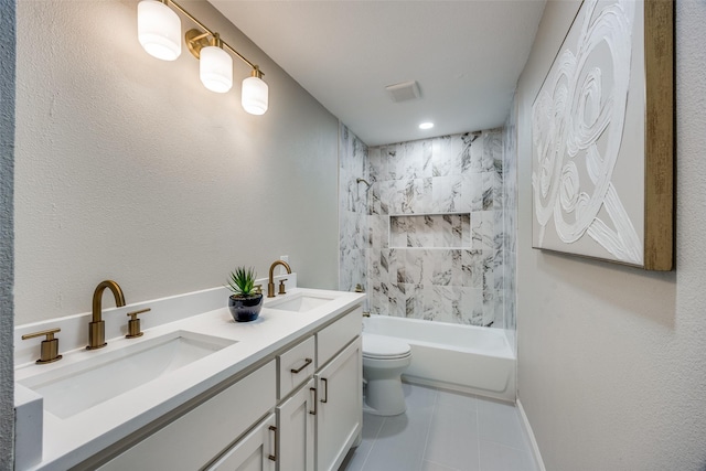 full bathroom with tile patterned floors, vanity, toilet, and tiled shower / bath