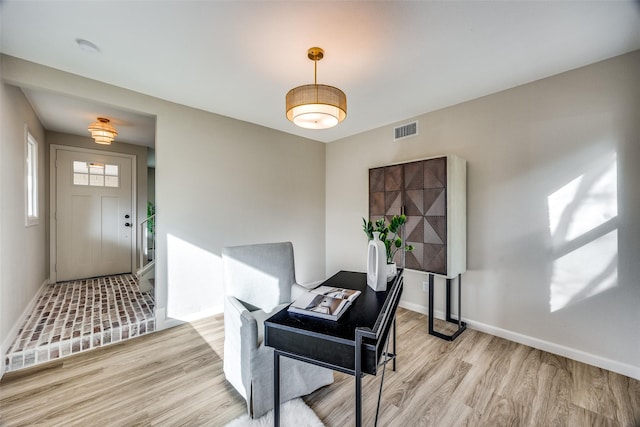 office space with light wood-type flooring