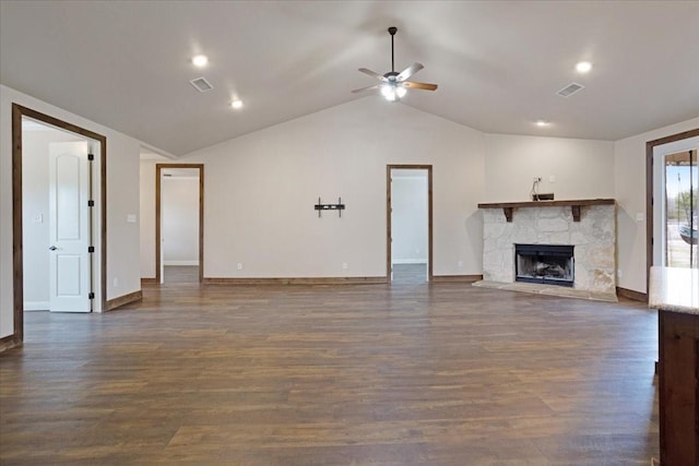 unfurnished living room featuring ceiling fan, a fireplace, dark hardwood / wood-style floors, and lofted ceiling