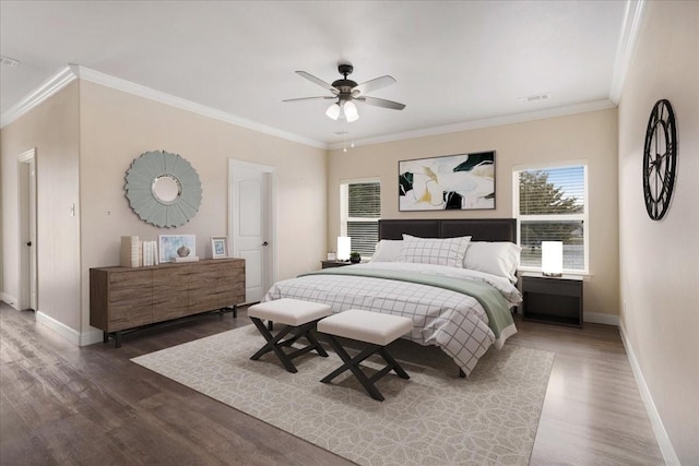 bedroom with dark hardwood / wood-style floors, ceiling fan, and ornamental molding