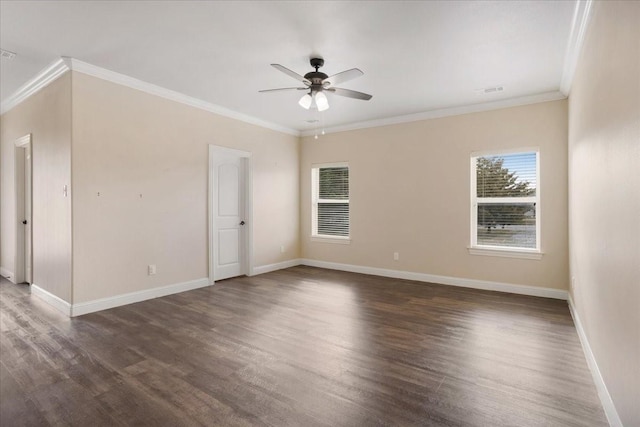 empty room featuring crown molding, ceiling fan, dark wood-style flooring, and baseboards