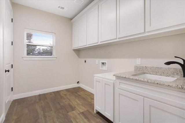 laundry area featuring cabinets, washer hookup, hookup for an electric dryer, sink, and dark hardwood / wood-style floors