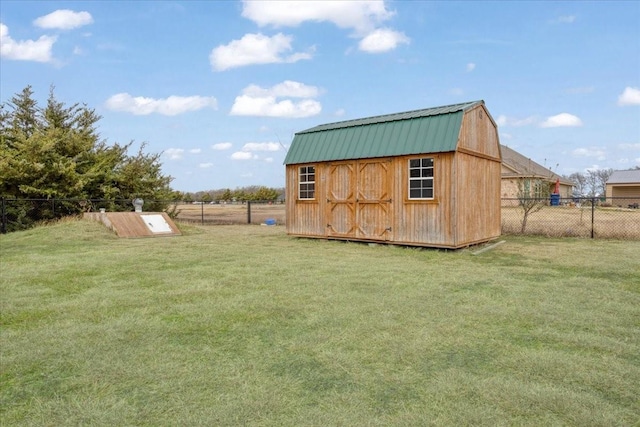 view of outbuilding featuring a lawn