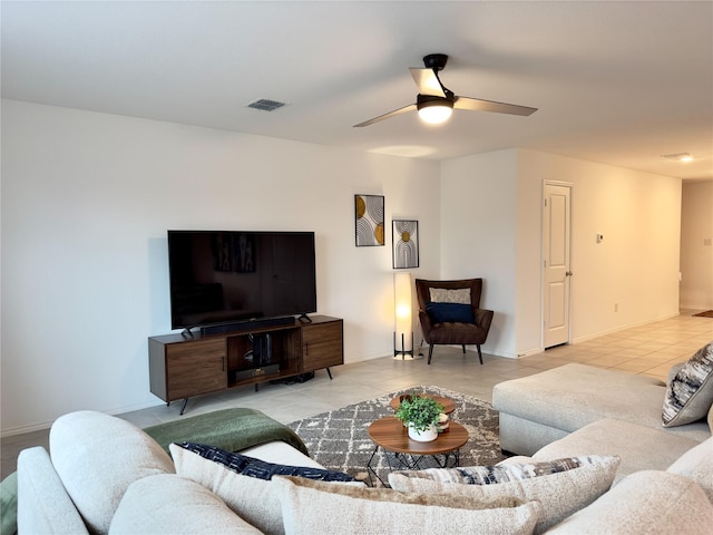 living room with light tile patterned floors and ceiling fan