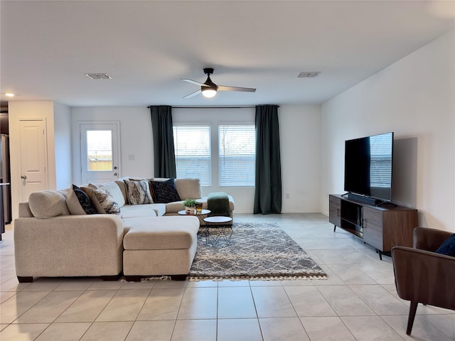 tiled living room featuring ceiling fan