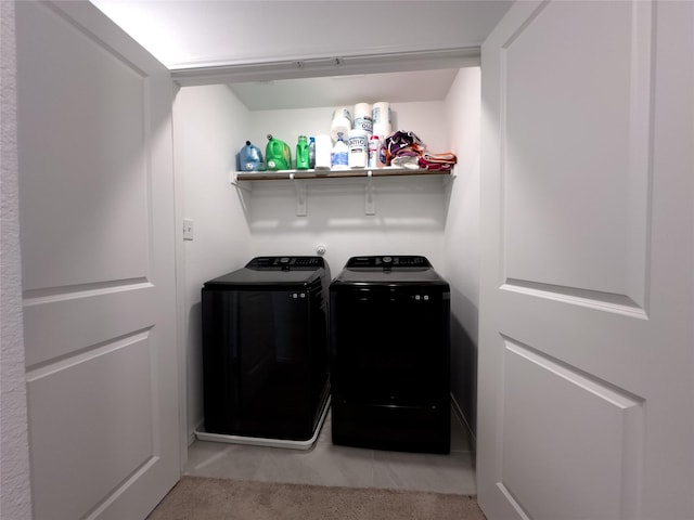 laundry area with light colored carpet and independent washer and dryer