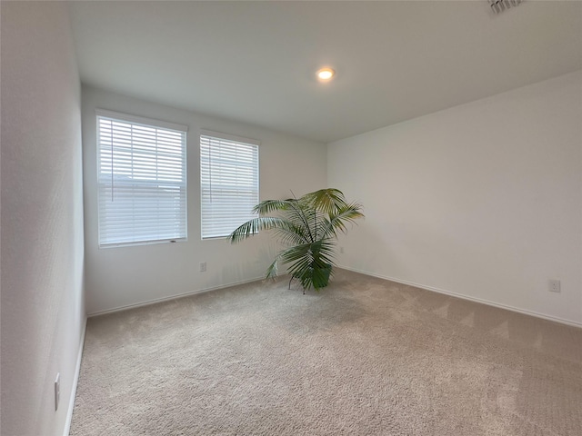 view of carpeted spare room