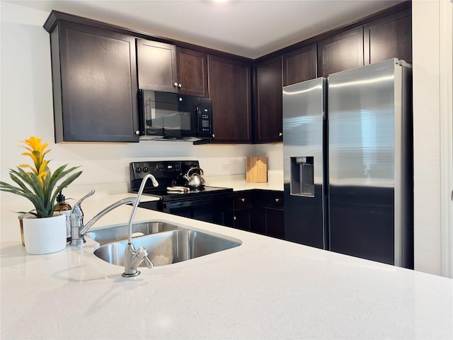 kitchen with sink, black appliances, and dark brown cabinets