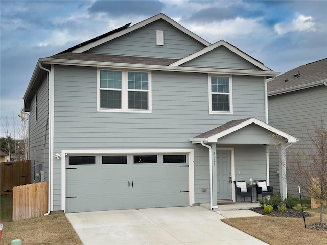 view of front of property with a garage