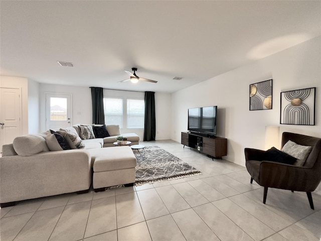 living room featuring ceiling fan and light tile patterned floors