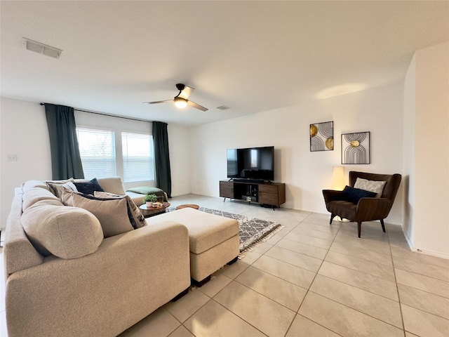 tiled living room featuring ceiling fan