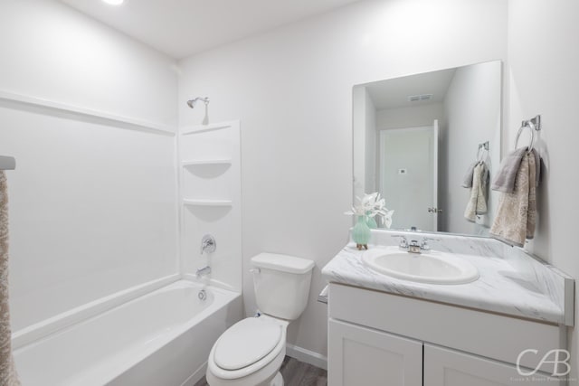 full bathroom with toilet, vanity, hardwood / wood-style floors, and bathing tub / shower combination