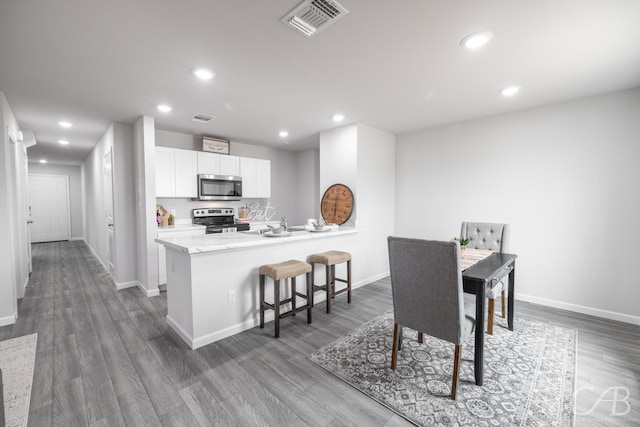 dining room with dark hardwood / wood-style floors