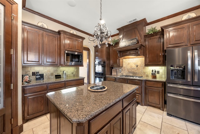 kitchen with a center island, an inviting chandelier, hanging light fixtures, decorative backsplash, and stainless steel appliances