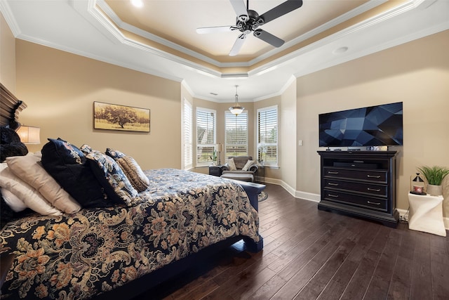 bedroom with a raised ceiling, ceiling fan, and ornamental molding