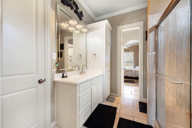 bathroom with vanity, a shower with door, tile patterned flooring, and ornamental molding