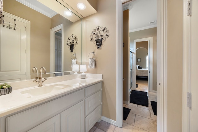 bathroom with tile patterned flooring, vanity, and ornamental molding