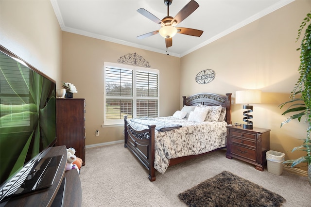 bedroom with ceiling fan, ornamental molding, and light carpet