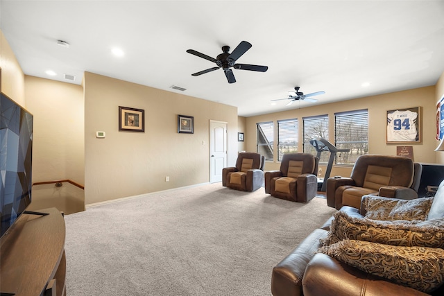 living room featuring carpet floors and ceiling fan