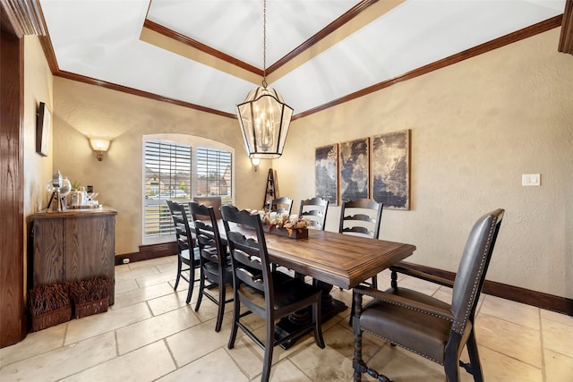 dining room with ornamental molding and an inviting chandelier